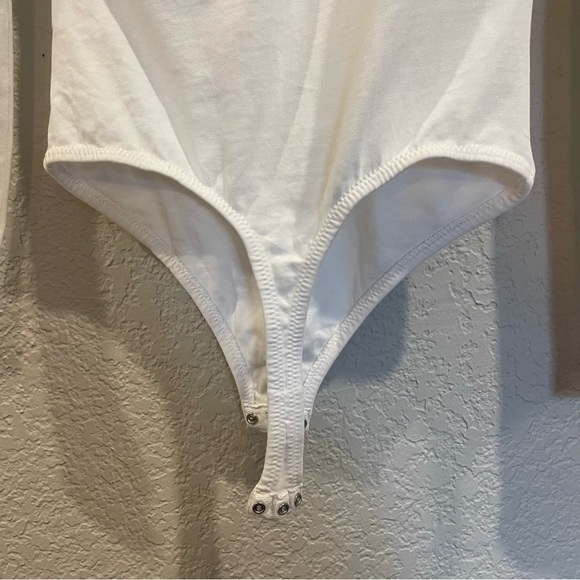 Grlfrnd Eryka Long Sleeve Jersey Knit Paddle Thong Bodysuit in White - Picture 12 of 13